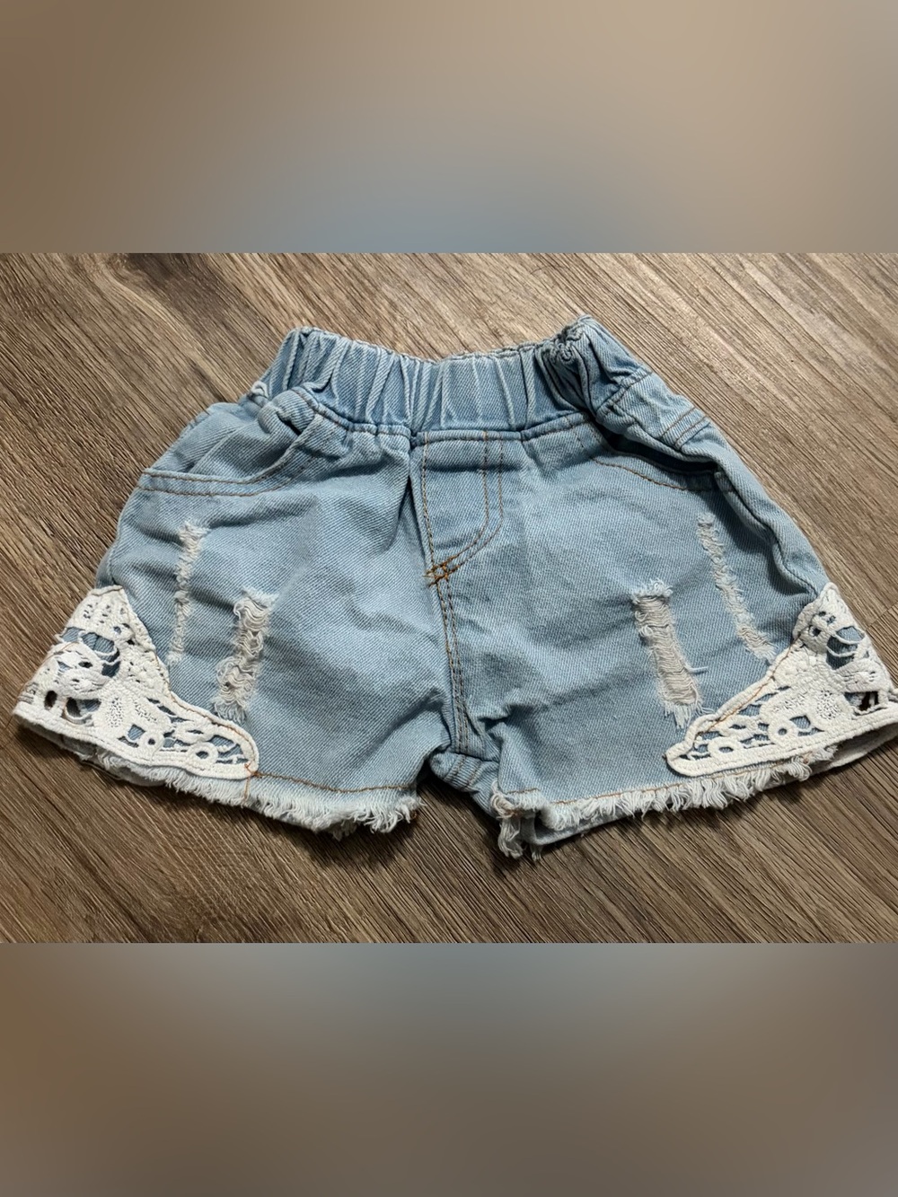 Distressed Light Wash Denim Shorts with Lace Trim and Frayed Hem - Size Small